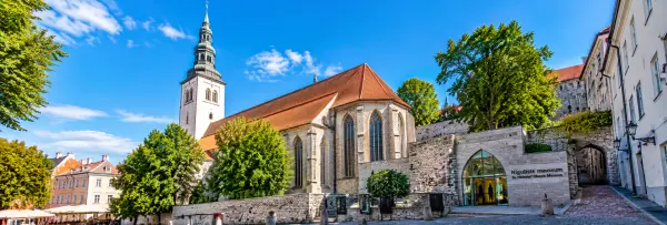 St. Nicholas’ Church and Museum in Tallinn, featuring Gothic architecture, a historic tower and medieval stone walls.