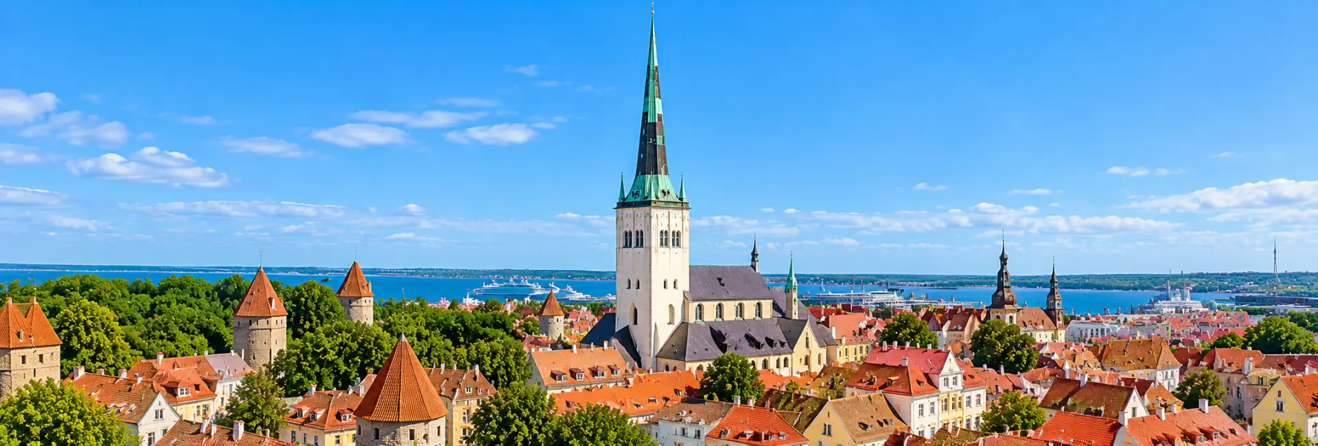 St. Olaf’s Church in Tallinn, Estonia, featuring its towering Gothic spire above the medieval Old Town rooftops.