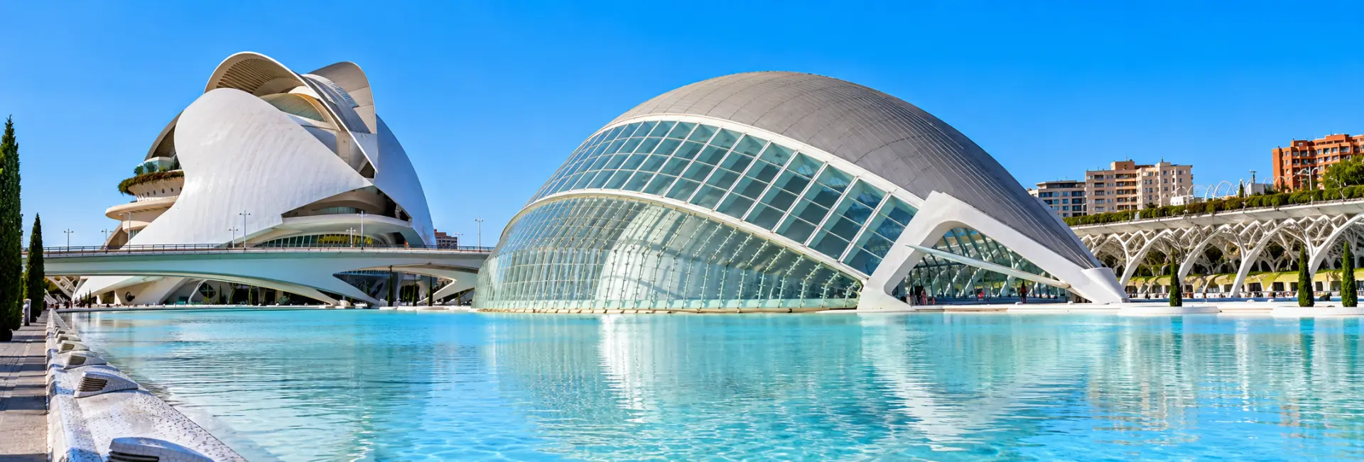 City of Arts and Sciences in Valencia, Spain, featuring futuristic white architecture and reflecting pools.