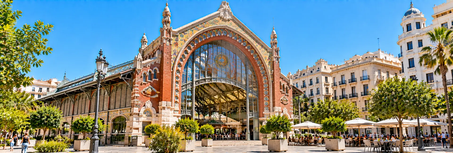 Mercado de Colón in Valencia, Spain, featuring an ornate Art Nouveau façade and colorful mosaics.