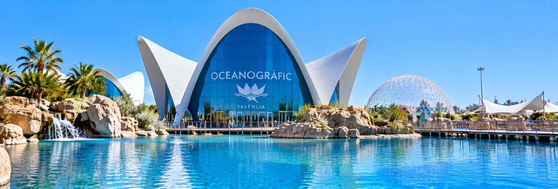 Oceanogràfic in Valencia, Spain, featuring futuristic white architecture and blue glass buildings.