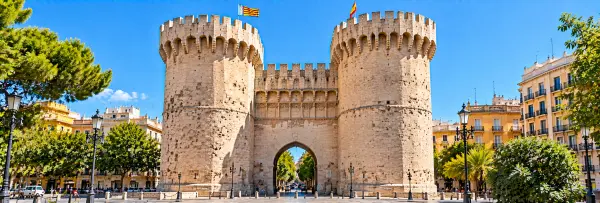 Torres de Quart in Valencia, Spain, featuring historic stone towers and a medieval arched gateway.