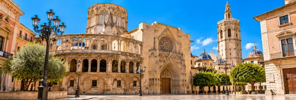 Valencia Cathedral in Spain, featuring its Gothic façade, ornate bell tower, and historic architecture.