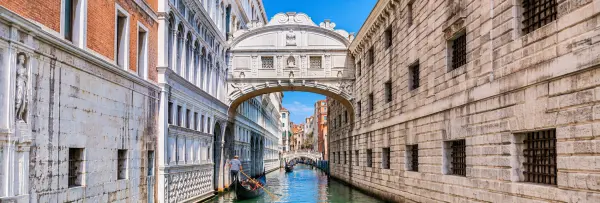Bridge of Sighs in Venice, Italy, spanning a narrow canal between historic stone buildings.