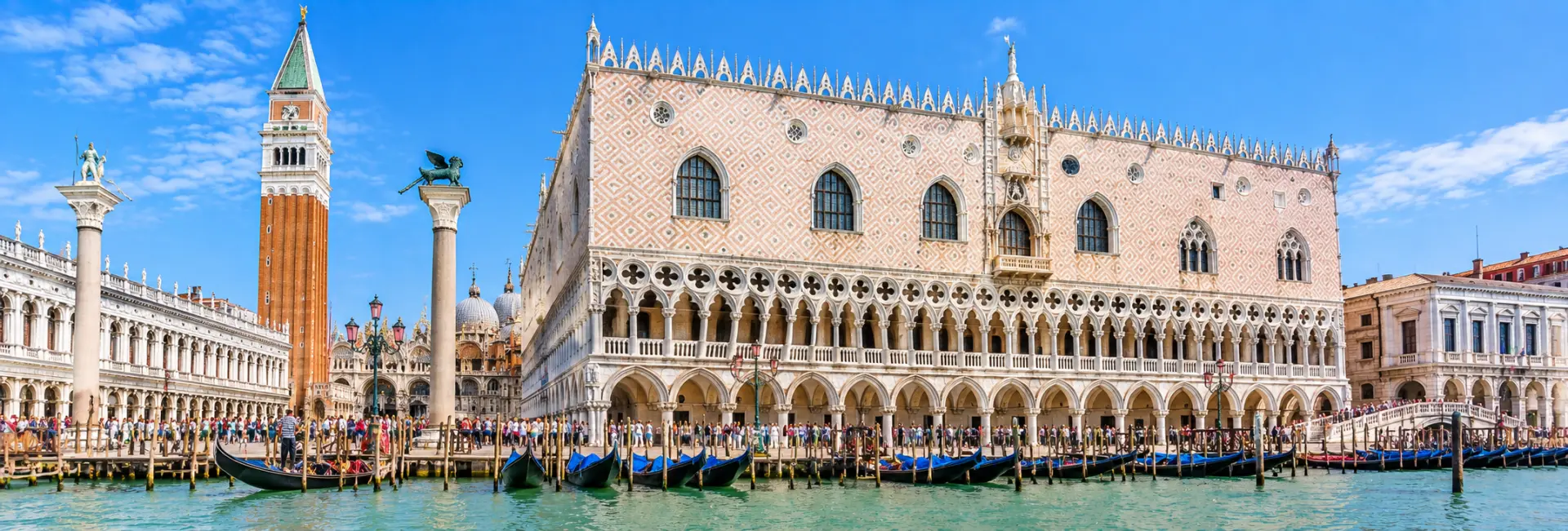 Doge’s Palace in Venice, Italy, with its ornate Gothic façade, arches, columns, and Venetian waterfront.