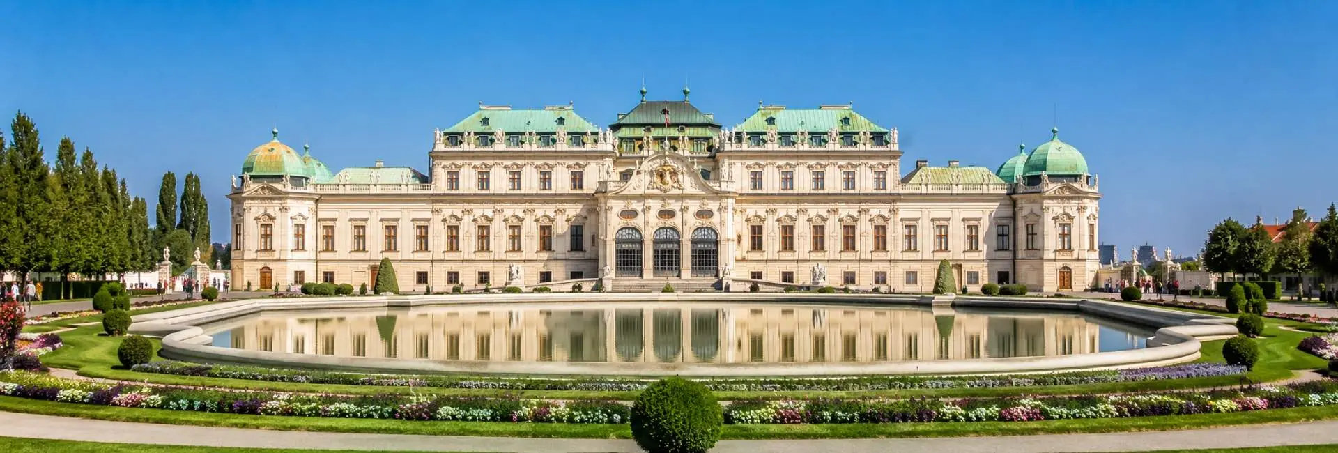 Belvedere Palace in Vienna reflected in its formal gardens and large ornamental pool