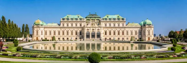 Belvedere Palace in Vienna reflected in its formal gardens and large ornamental pool