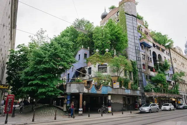 Hundertwasserhaus in Vienna surrounded by trees and colorful architectural details