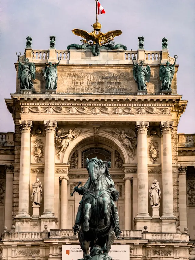 Neue Burg wing of Hofburg Palace in Vienna with an ornate equestrian monument