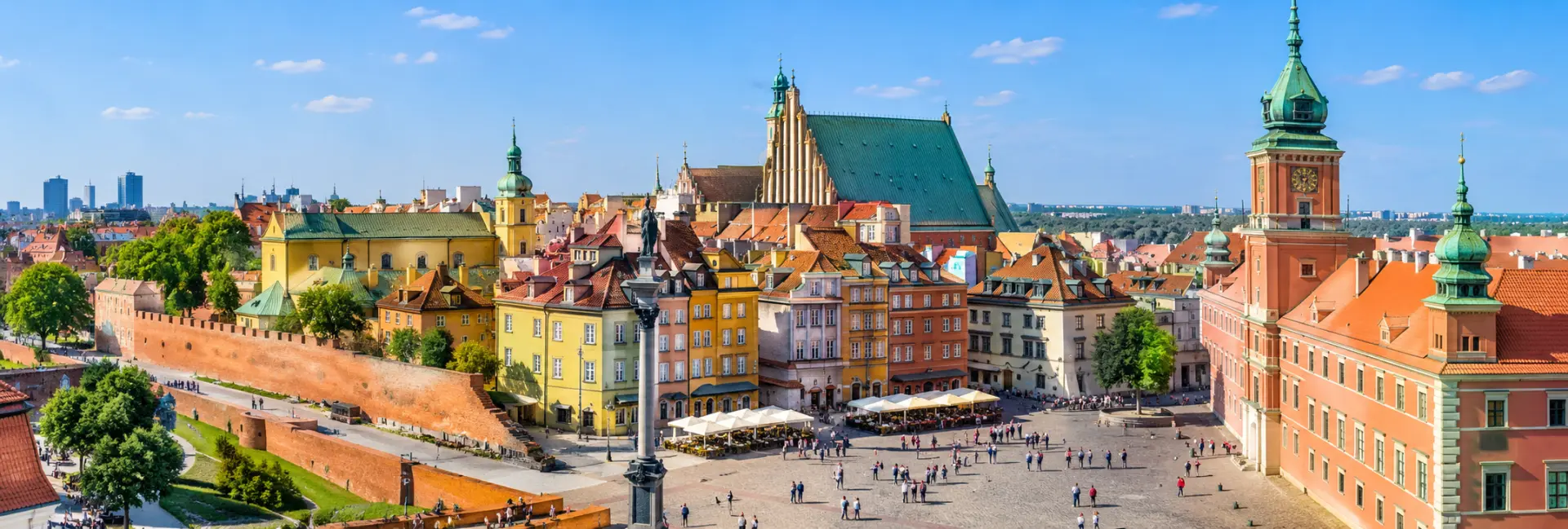 Royal Castle in Warsaw with its historic red façade and clock tower in Castle Square