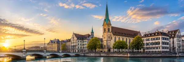 Fraumünster Zurich with its distinctive green spire, historic buildings and riverside setting
