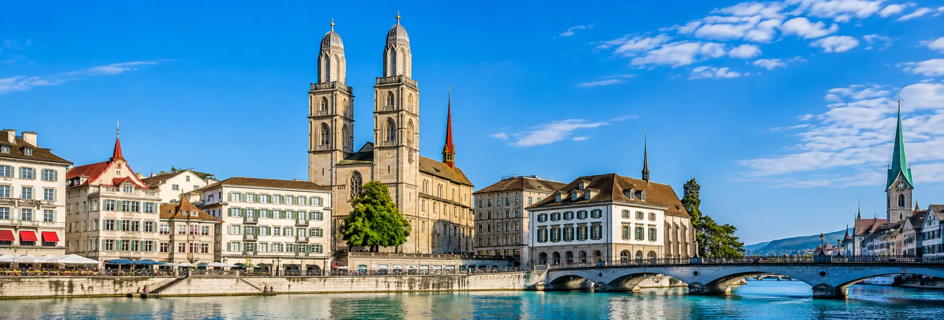 Grossmünster in Zurich with its twin towers, historic buildings and riverside setting