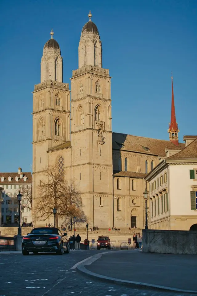 Grossmünster Zurich with twin towers and historic buildings under a clear blue sky