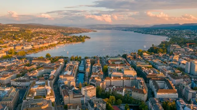 Aerial view of Lake Zurich surrounded by the city, hills and waterfront neighborhoods