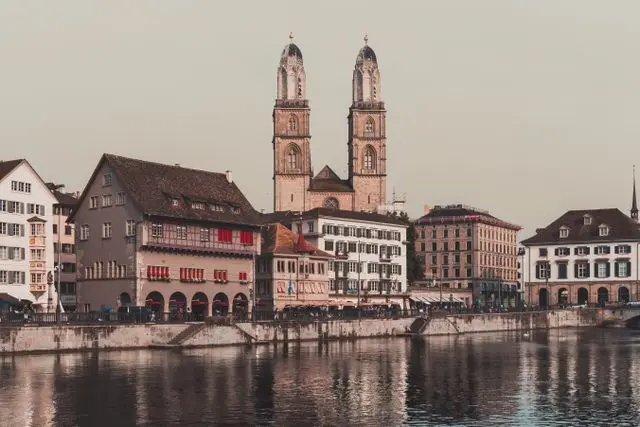 Zurich Old Town waterfront with Grossmünster, historic buildings and the Limmat River