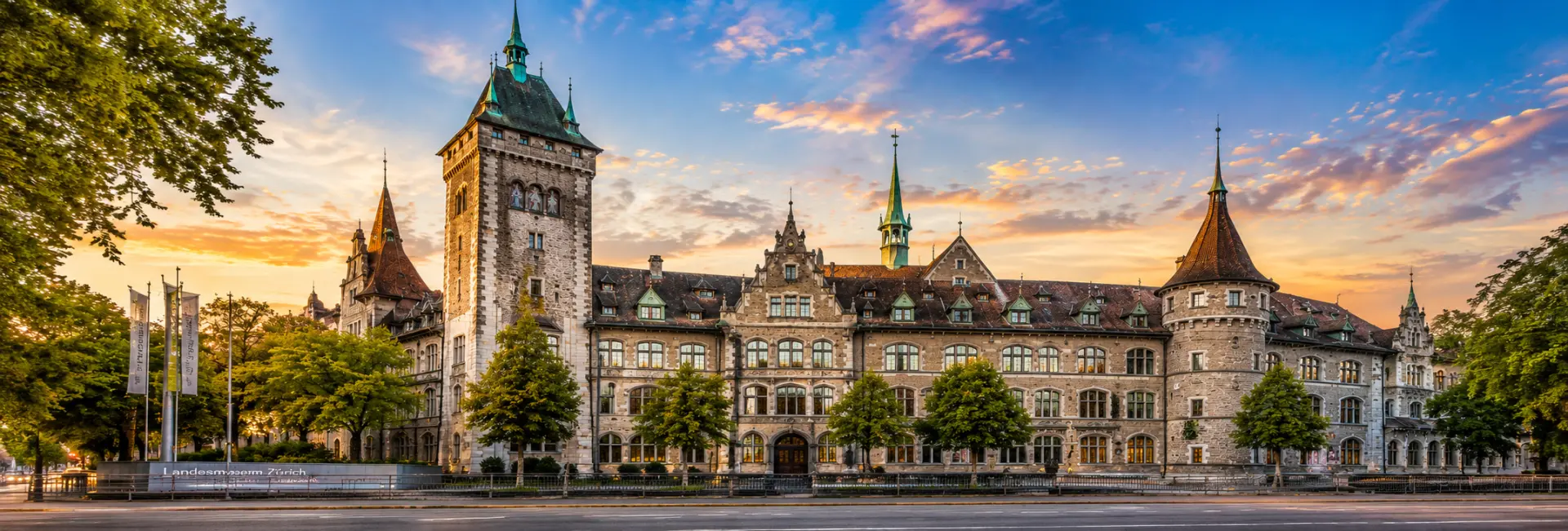 Swiss National Museum Zurich with its historic towers, ornate façade and green spires