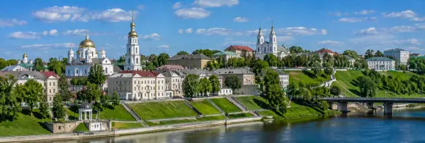 Panoramic view of Vitebsk, Belarus, with historic churches, green embankments and the Western Dvina River