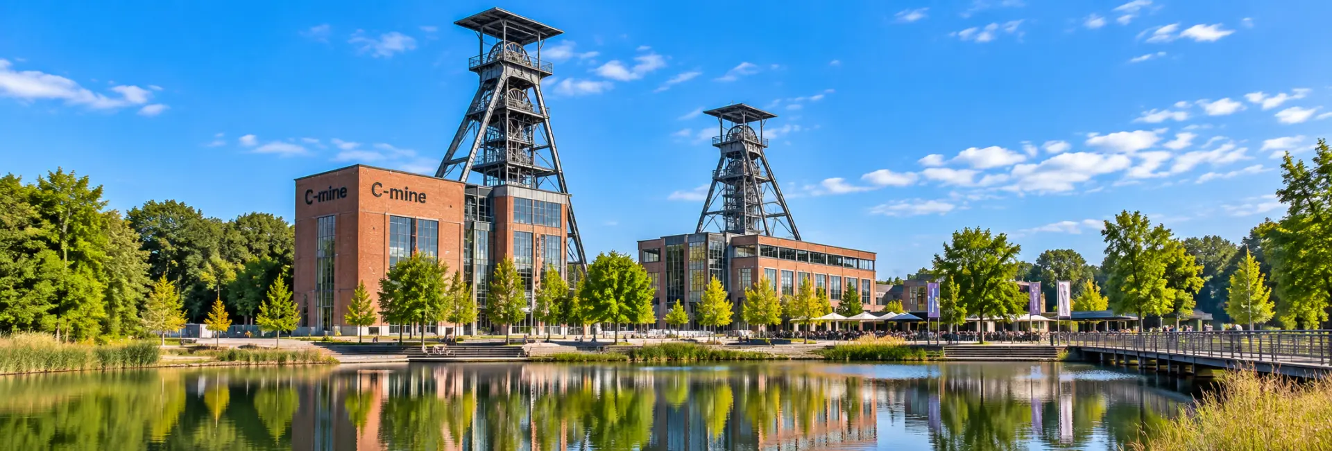 Genk, Belgium C-mine with historic mining headframes and red-brick industrial buildings