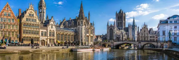 Ghent Belgium historic waterfront with medieval buildings, canals and famous church towers