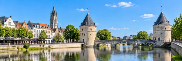 Kortrijk, Belgium with the historic Broeltorens, stone bridge, riverfront and medieval city architecture