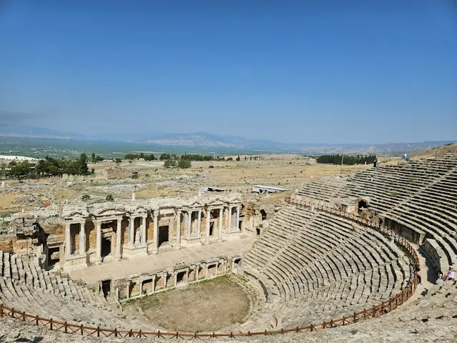 Ancient Roman theater at Hierapolis with stone seating and ruins