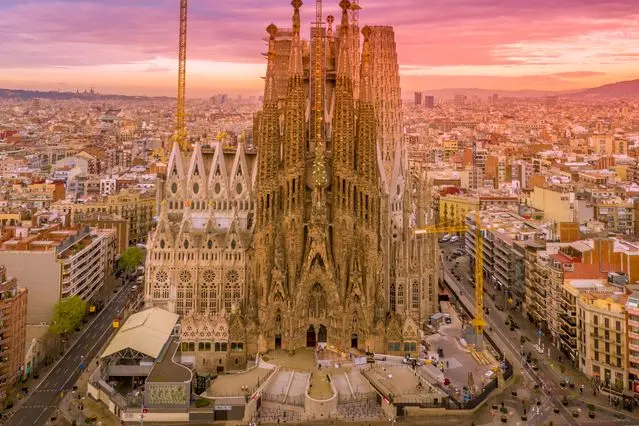 Sagrada Família basilica rising above Barcelona at sunset