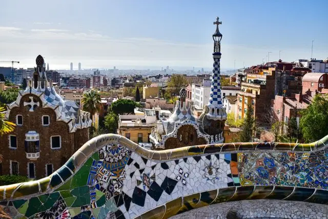 Park Güell with colorful mosaic benches overlooking Barcelona