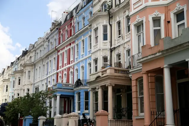 Colorful Victorian houses lining a residential street in Notting Hill, London