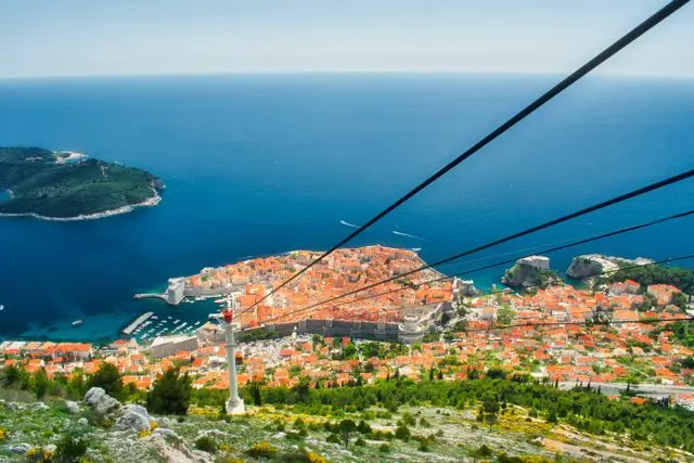 Panoramic view of Dubrovnik Old Town and the Adriatic Sea from the cable car route on Mount Srđ, Croatia.
