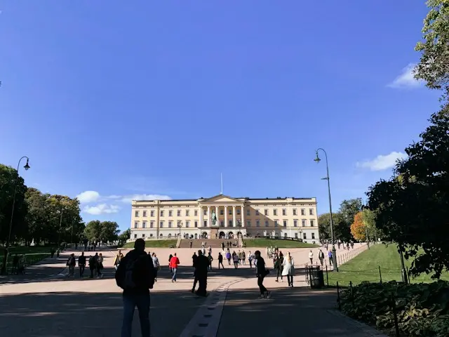 Royal Palace in Oslo, Norway, overlooking a spacious public square.