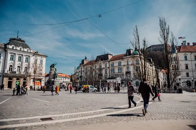 Prešeren Square in Ljubljana, Slovenia, featuring historic buildings, cobblestone paving, and the Prešeren Monument.