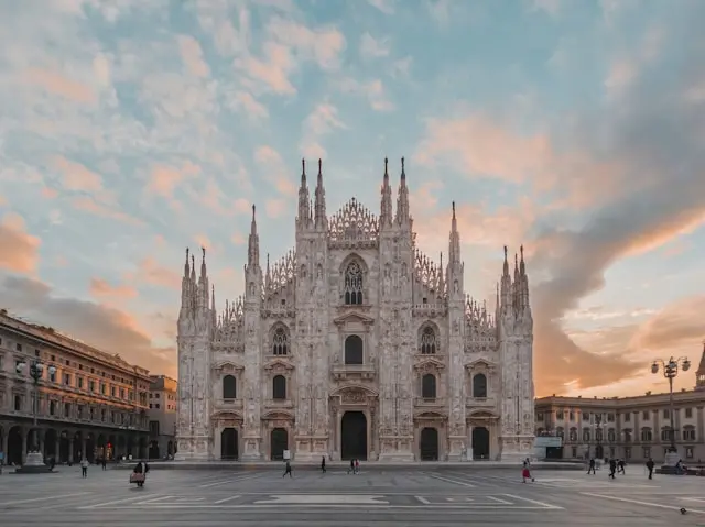 Milan Cathedral (Duomo di Milano) in Piazza del Duomo at sunset.