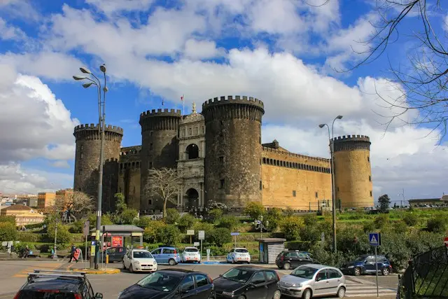Castel Nuovo fortress in Naples under a blue sky