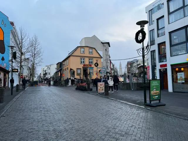 Pedestrian shopping street lined with shops and cafes in Reykjavik