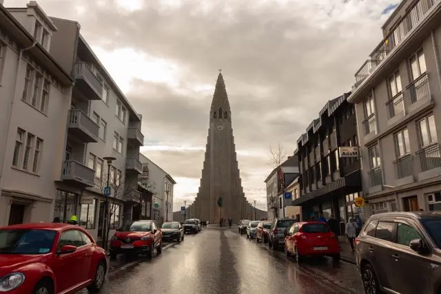 Hallgrímskirkja church rising above a street in central Reykjavik