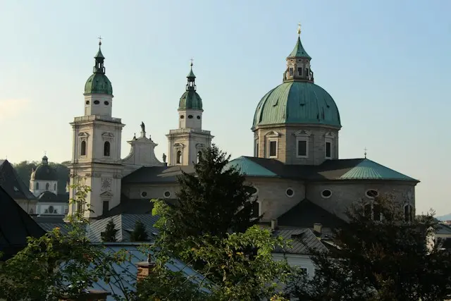 Salzburg Cathedral featuring its magnificent green dome and historic Baroque architecture in Salzburg, Austria.