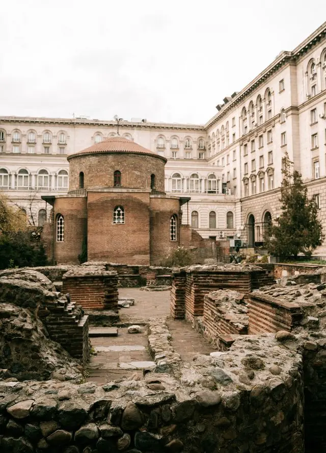 Saint George Rotunda in Sofia, Bulgaria, featuring an ancient red-brick church surrounded by Roman archaeological ruins.