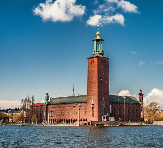 Stockholm City Hall with its iconic tower beside the waterfront in Sweden