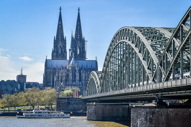 Cologne Cathedral and Hohenzollern Bridge beside the Rhine River