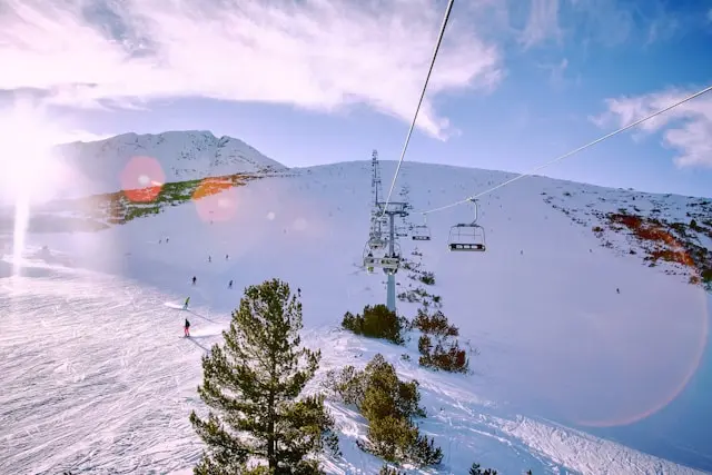 Snow-covered ski slopes and chairlift in Bansko, Bulgaria