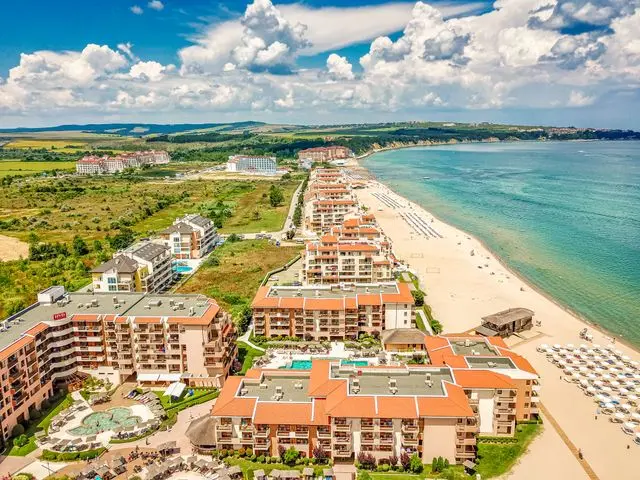 Aerial view of a Bulgarian Black Sea beach resort with hotels and turquoise water