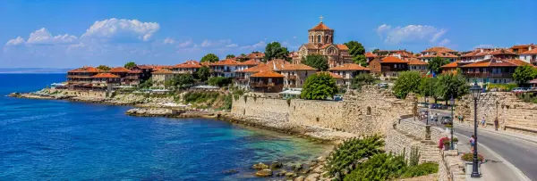 Historic Nessebar Old Town with Byzantine churches, stone walls and red-roofed houses beside the Black Sea.