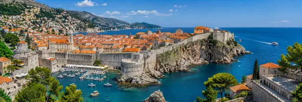 Dubrovnik Old Town with medieval walls, terracotta rooftops and Adriatic Sea in Croatia