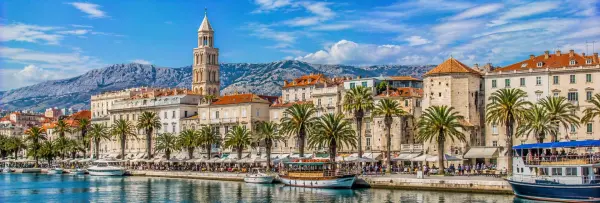 Split Croatia waterfront with Diocletian's Palace, palm trees and Adriatic Sea