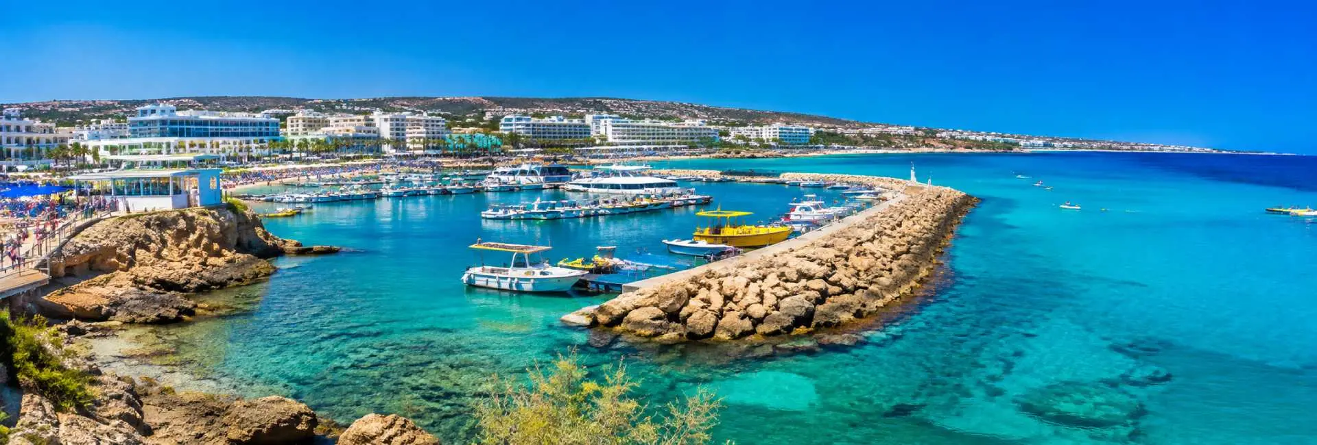 Ayia Napa, Cyprus panoramic view of turquoise Mediterranean waters, marina, boats and coastal resorts