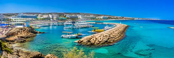 Ayia Napa, Cyprus panoramic view of turquoise Mediterranean waters, marina, boats and coastal resorts