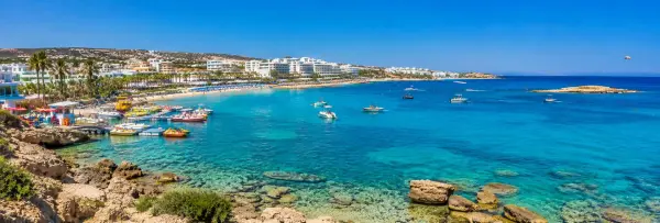 Protaras, Cyprus panoramic view of turquoise Mediterranean waters, sandy beach, boats and coastal resorts