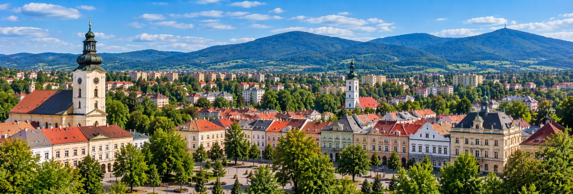 Panoramic view of Frýdek-Místek with historic buildings, church towers and the Beskydy Mountains