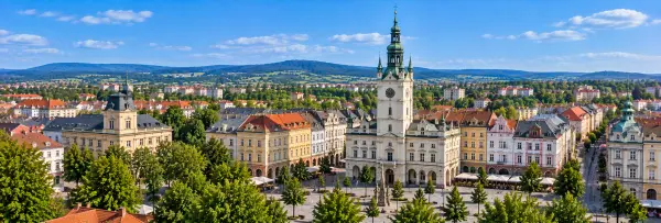 Panoramic view of Opava with Hláska tower, historic square, colorful buildings and surrounding hills