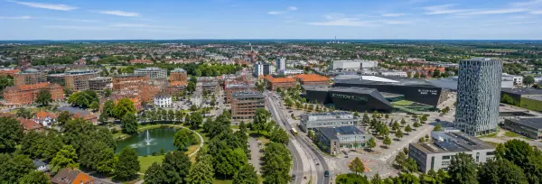 Aerial panoramic view of Herning, Denmark, featuring Jyske Bank BOXEN and the surrounding cityscape